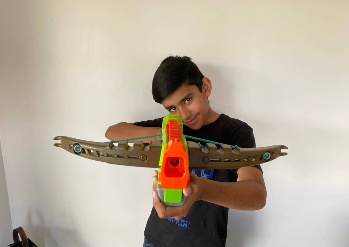 Boy holding a crossbow nerf