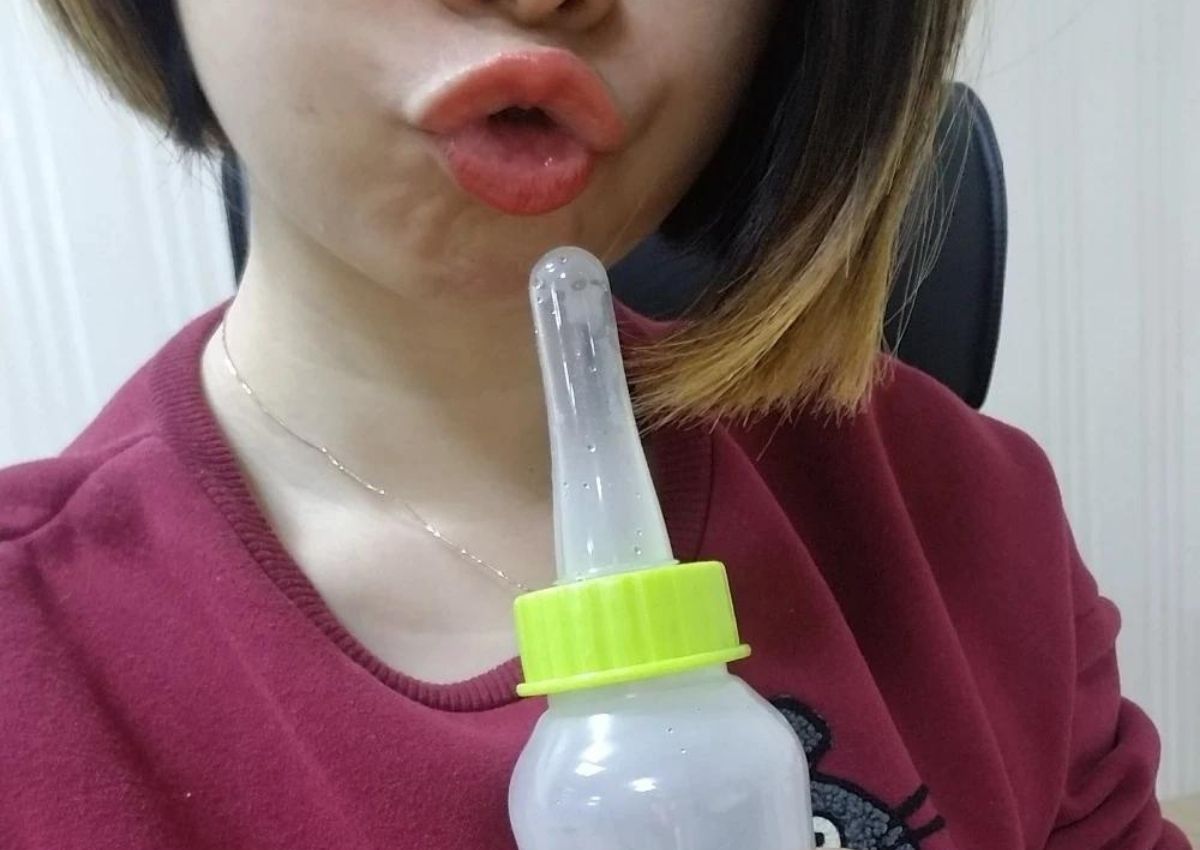 female using baby bottle
