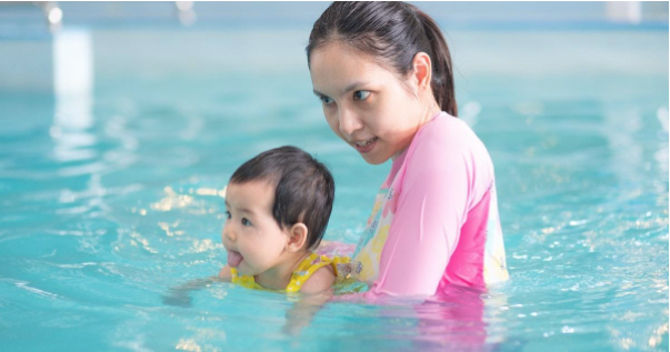 Infant Taking Swimming Lesson