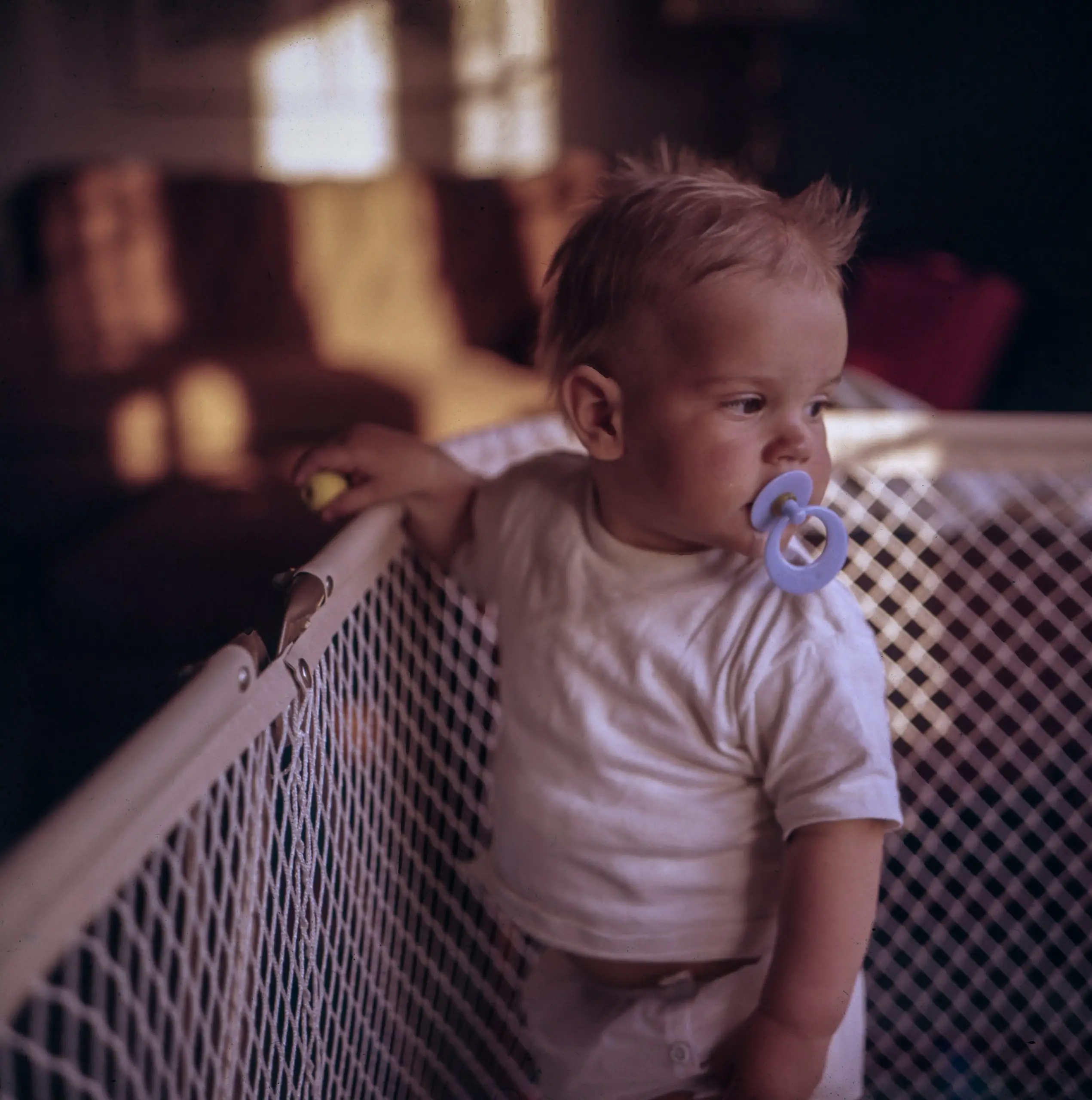 baby standing in a crib