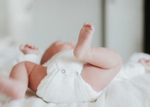 baby throwing legs in the air while sleeping