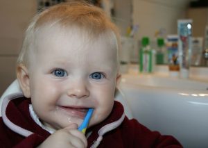 Toddler brushing his teeth