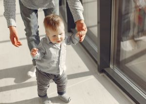 little boy learning to walk