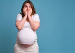 confused pregnant woman