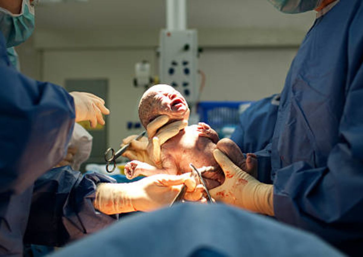 Dr Holding a Newborn baby